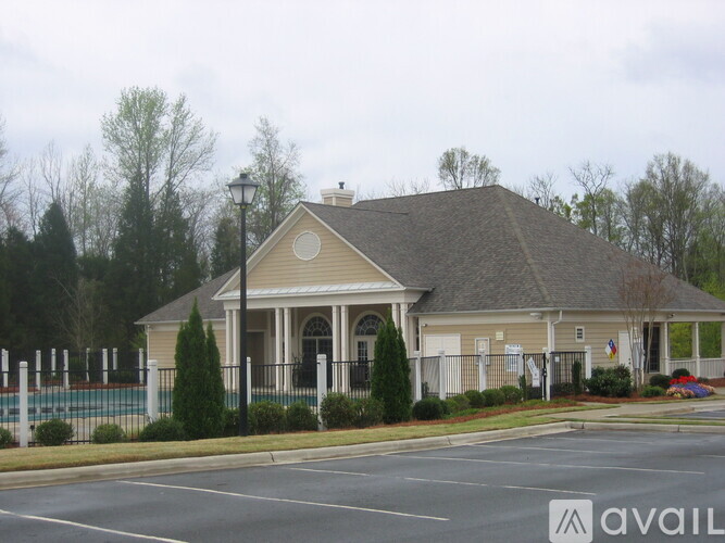 A building with a parking lot in front of it.