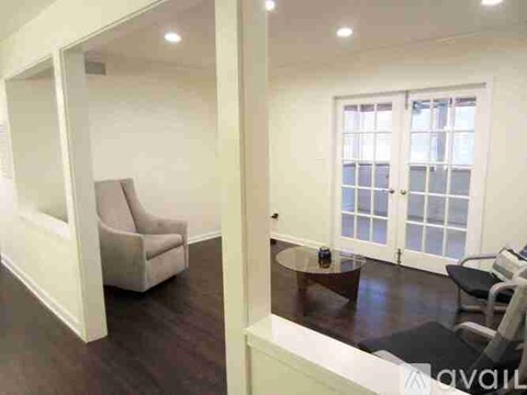 A living room with a couch and a table.