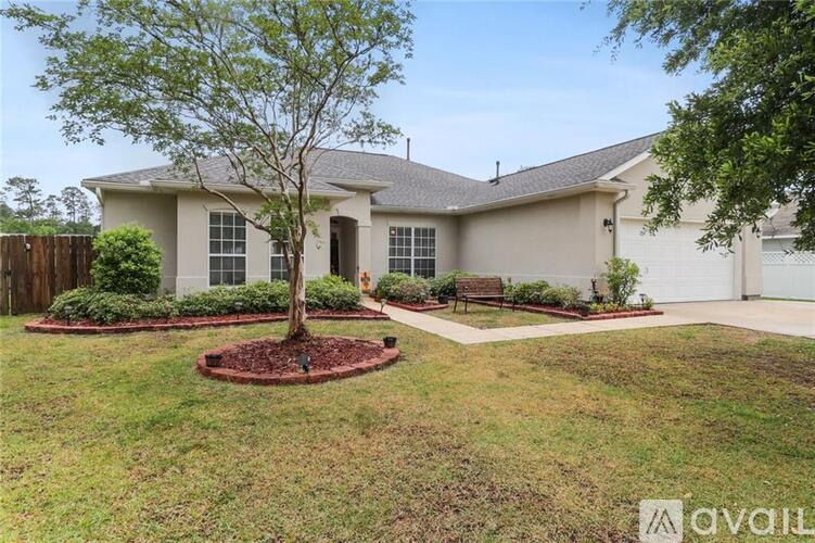 A house with a tree in front of it.