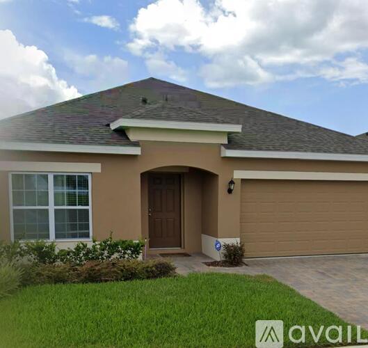 A house with a brown garage door and a brown door.