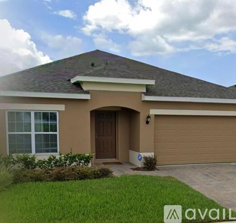 A house with a brown garage door and a brown door.