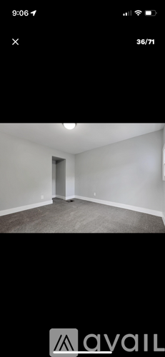 A room with a door and a wall.
