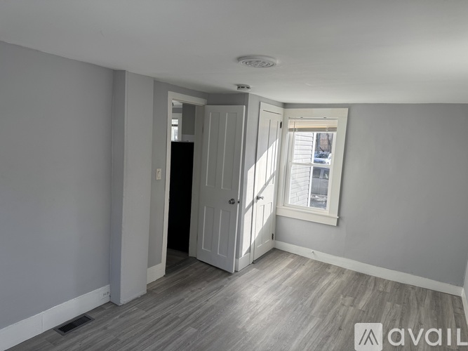 A room with a door and a window.