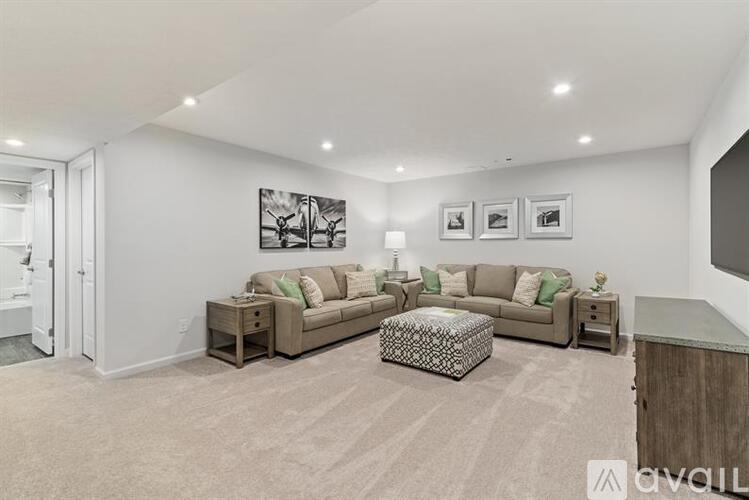 A living room with a large couch and a coffee table.