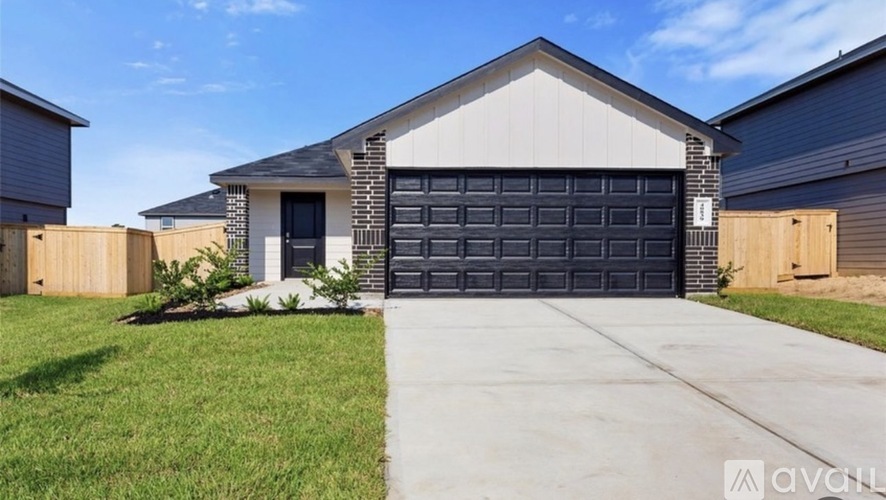 A house with a garage door is for sale.