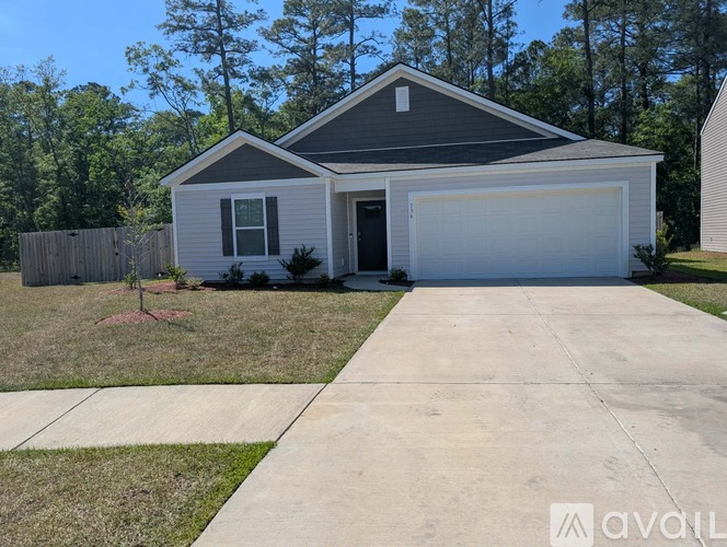A house with a garage is available for sale.