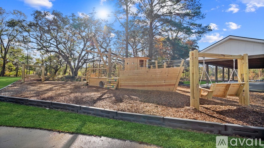 A playground with a wooden structure and a slide is available for use.