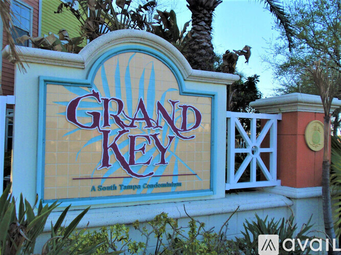 A sign that says Grand Key in front of a building.