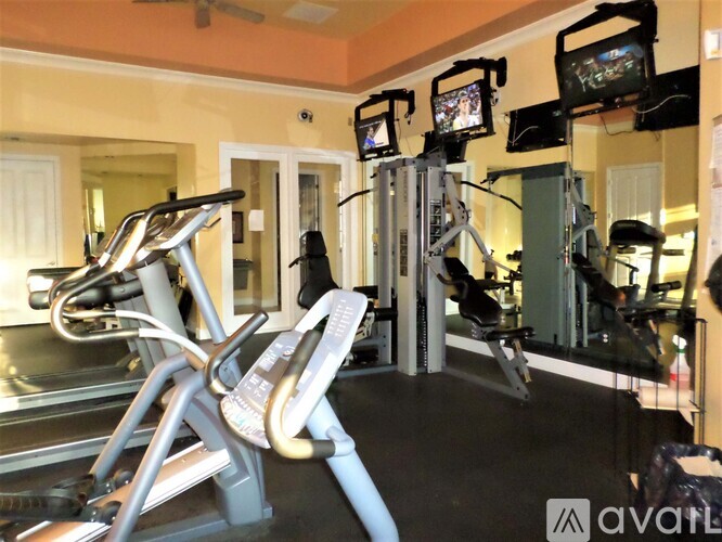 A gym with treadmills and exercise bikes.