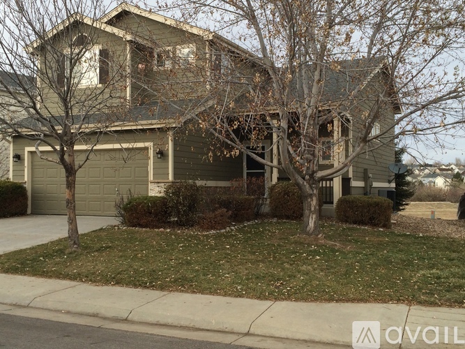 A house with a tree in front of it.
