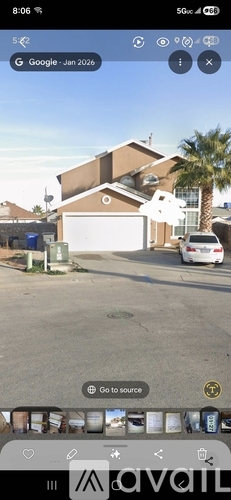 A house with a brown roof and a white car parked in front.