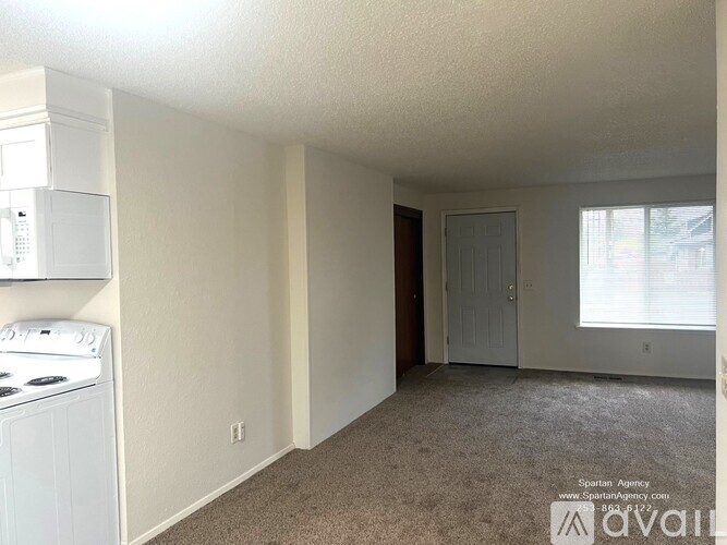 A spartan agency image of a small room with a washer and dryer.