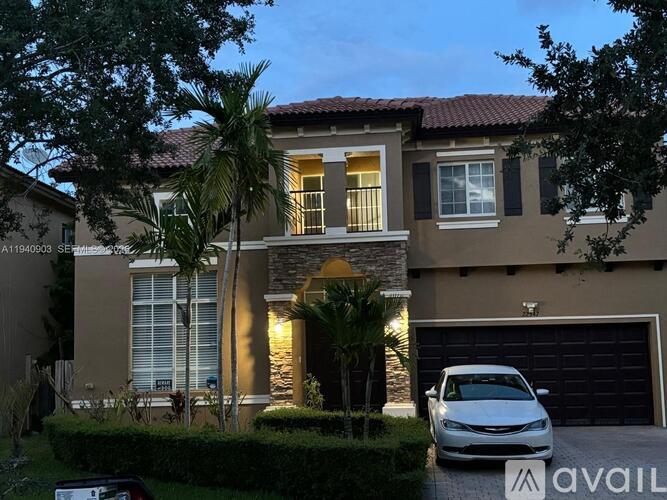 A house with a car parked in front of it.