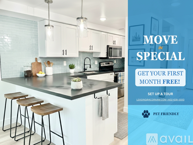 A kitchen with a countertop, bar stools, and a sign offering a free first month.