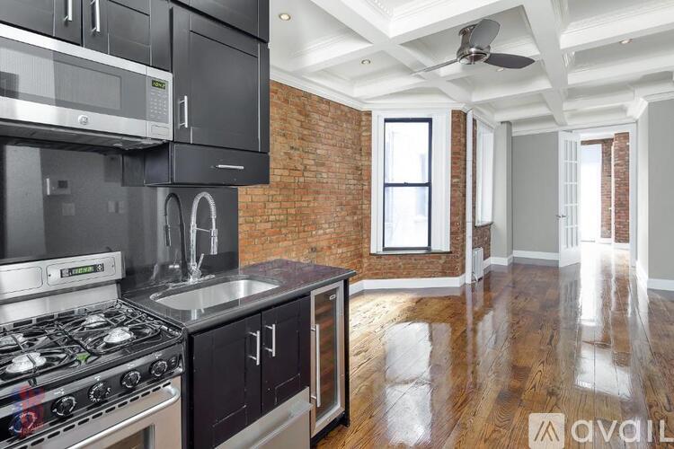 A kitchen with a stove top oven and a microwave.