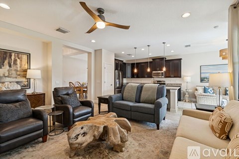 A living room with a wood coffee table and a white couch.