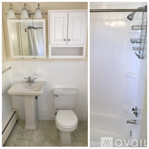 A white bathroom with a sink, toilet and shower.