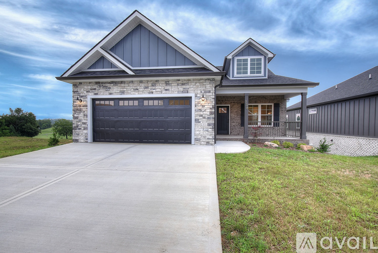 A house with a garage is available for sale.