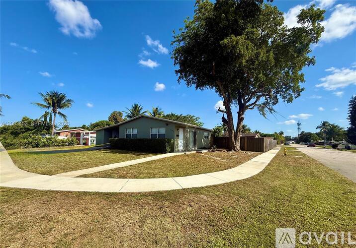 A house with a tree in front of it.