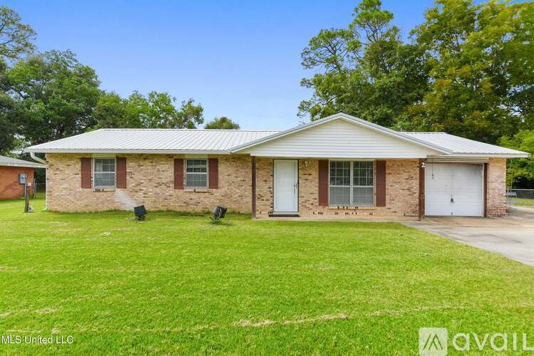 A house with a white garage door is for sale.