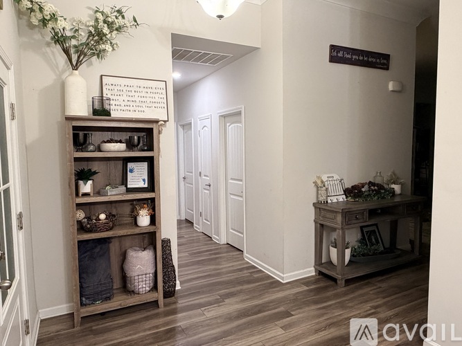 A hallway with a wooden floor and a sign that says "All rights reserved.".