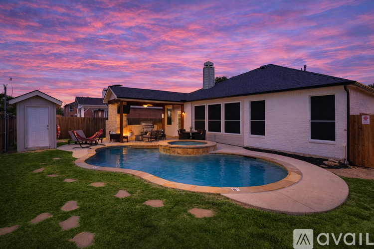 A house with a pool in the backyard.