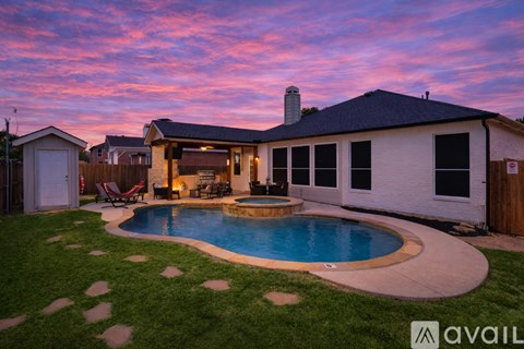 A house with a pool in the backyard.