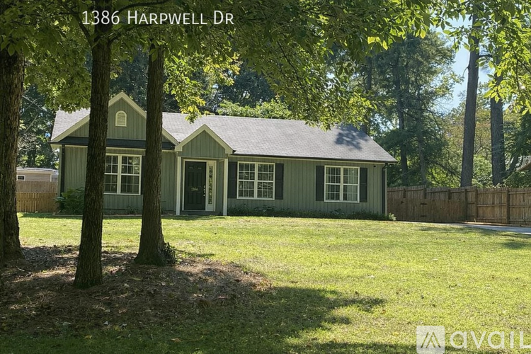 A house with the address 1386 Harpwell Dr is for sale.