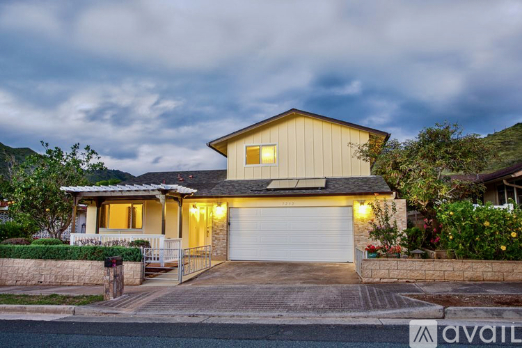 A house with a garage is available for sale.