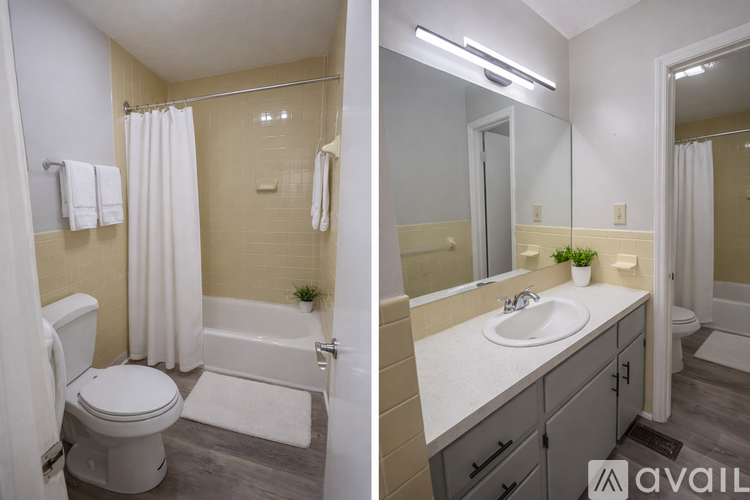 A bathroom with a toilet, sink, and bathtub.