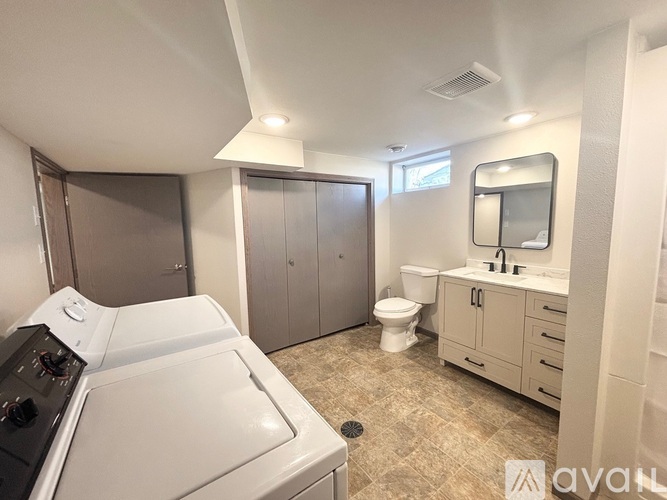 A small, clean, and well-organized kitchen and bathroom area.