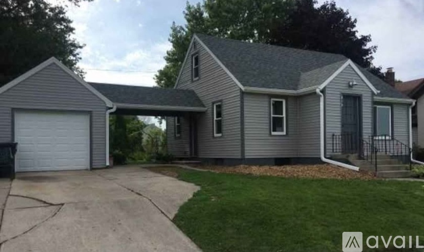 A house with a garage is available for sale.