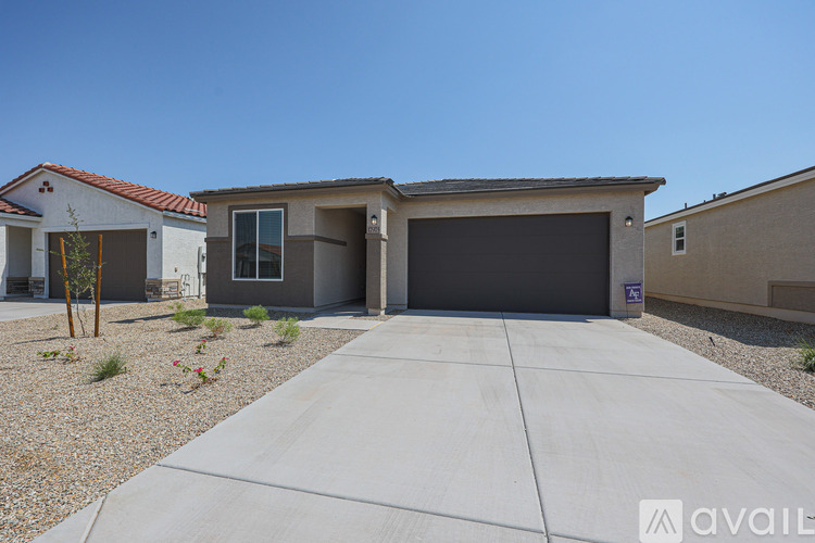 A house with a driveway and a garage door.