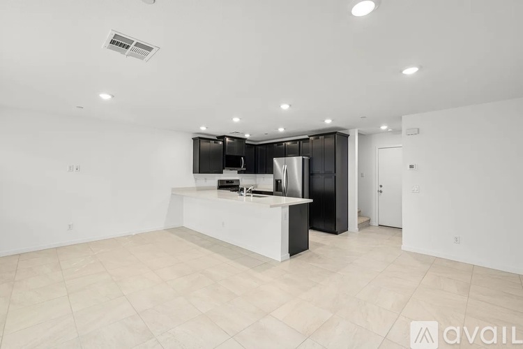 A kitchen area with a counter and cabinets.