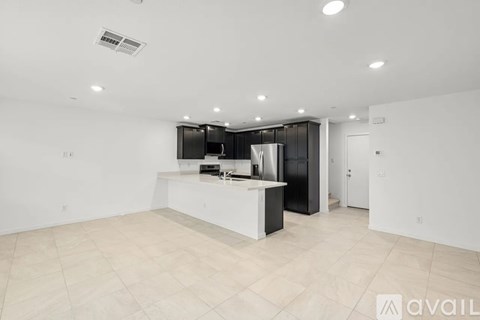 A kitchen area with a counter and cabinets.