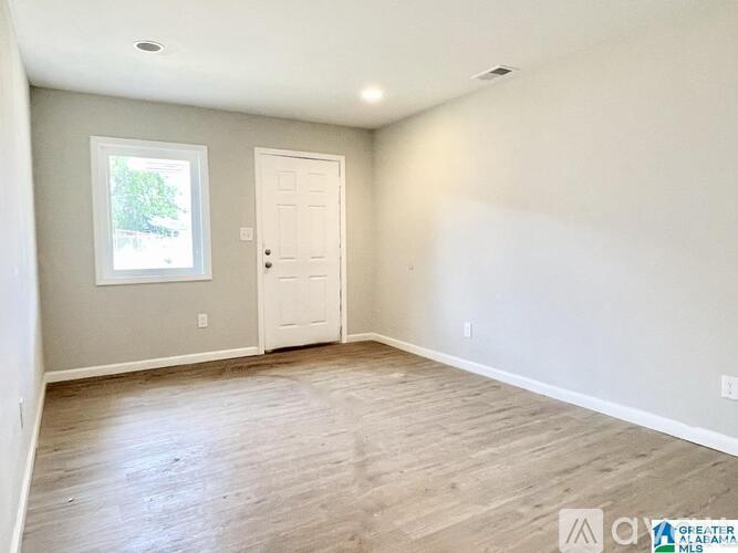A room with a door and a window.