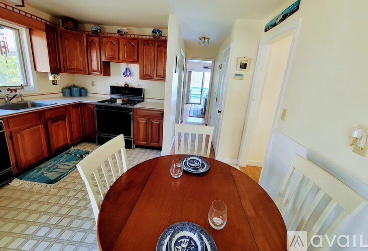 A kitchen with a table set for two.