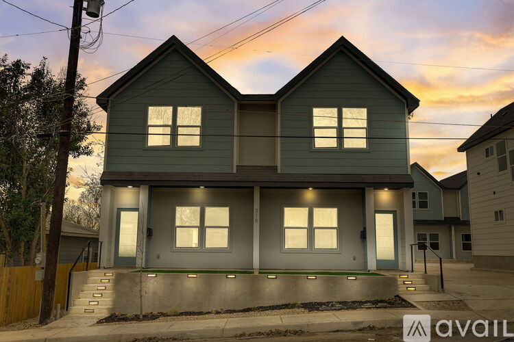 A house with a grey exterior is available for purchase.