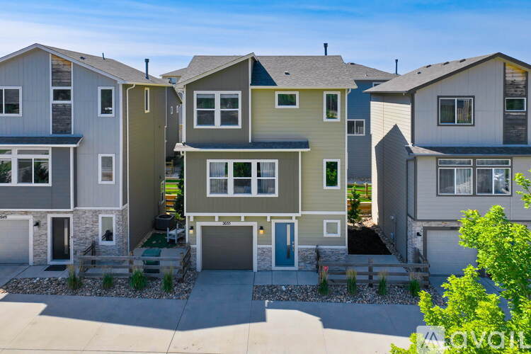 A row of houses with a sign that says "Available" in front of them.