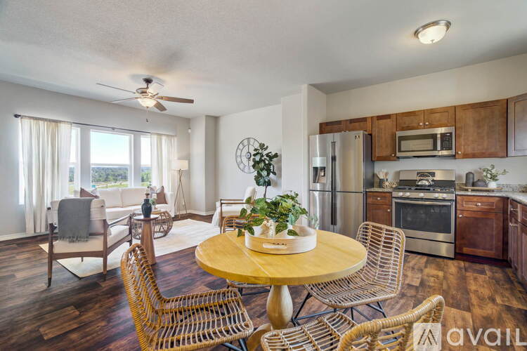 A kitchen with a table and chairs in the middle of the room.