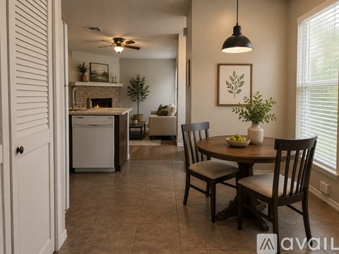 A kitchen with white appliances and brown cabinets.