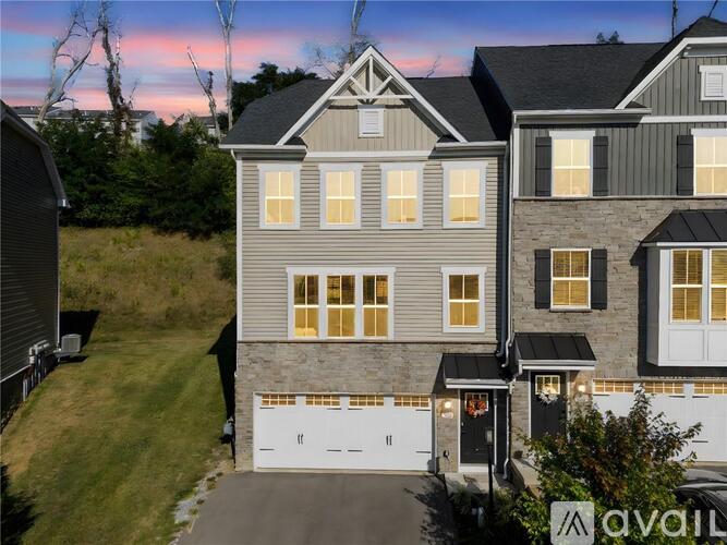 A house with a garage is available for sale.