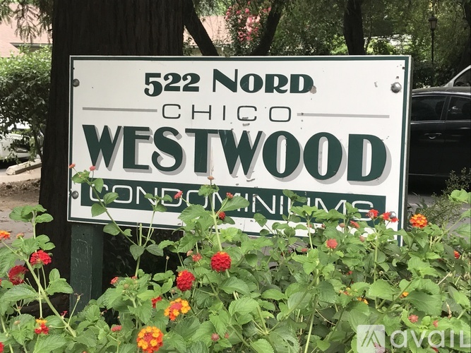 A white sign with black lettering that says 522 Nord Chico Westwood.