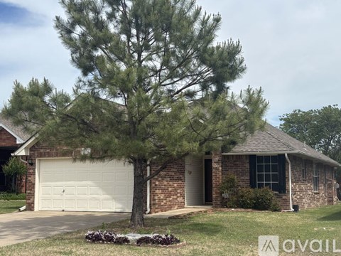 A house with a tree in front of it.