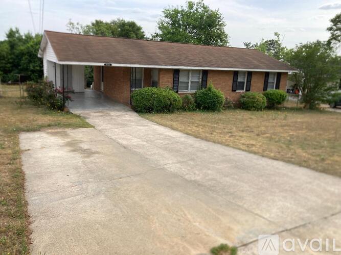 A house with a driveway in front of it.