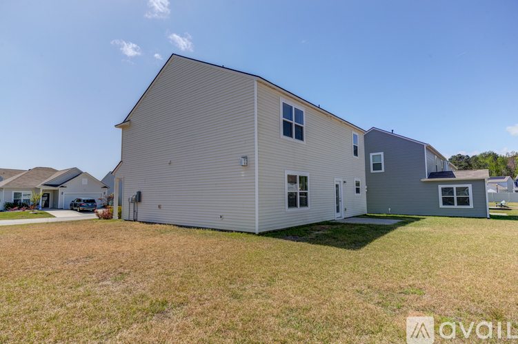 A house with a grey and white exterior is available for rent.