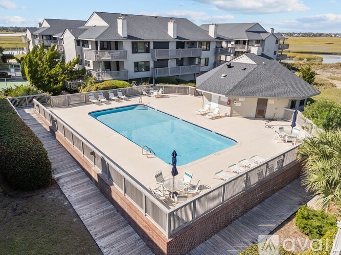 A large house with a pool in the backyard.