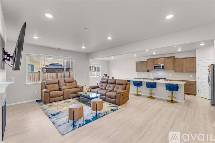 A living room with a large couch and a television.