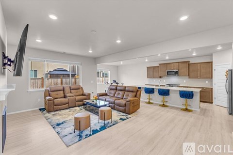 A living room with a large couch and a television.