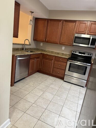 A kitchen with a stove top oven and microwave.